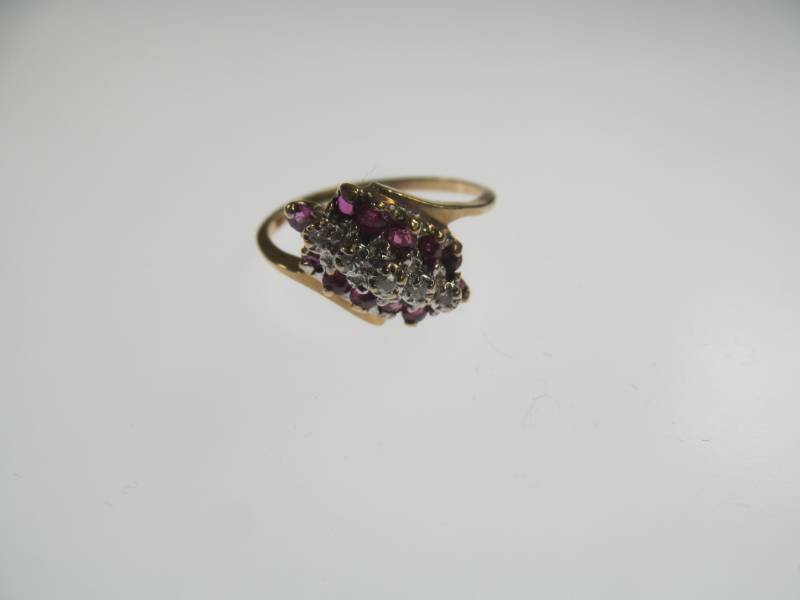 lot 16 image: 14 Cart Gold Ring with Ruby and Diamond Cluster