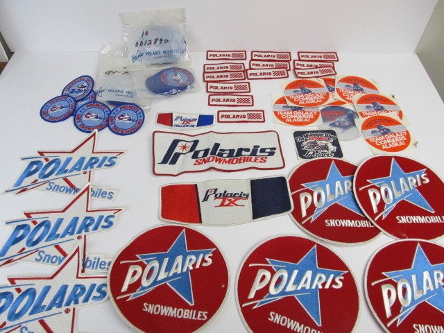 lot 44 image: Large Lot of NOS Unused Vintage POLARIS Promo Advertising Patches & Stickers