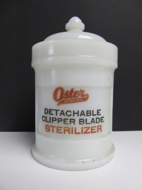 lot 46 image: Old Vintage Milk Glass OSTER Razor Advertising Barber Shop Sterilizer Jar
