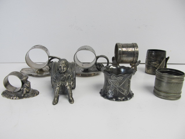 lot 60 image: Collection of Antique Figural etc Silver Plated Napkin RingsHolders