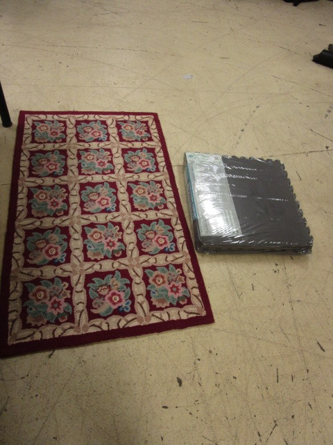 lot 579 image: AREA RUG AND INTERLOCKING FLOOR MATS