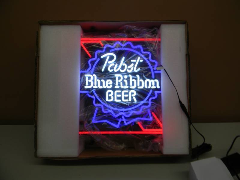 lot 9 image: PABST BLUE RIBBON LED LIGHT - NEVER USED NEW IN BOX - AWESOME LIGHT FOR ANY MAN CAVE - APPROX 16 BY 16 - SEE PICTURES