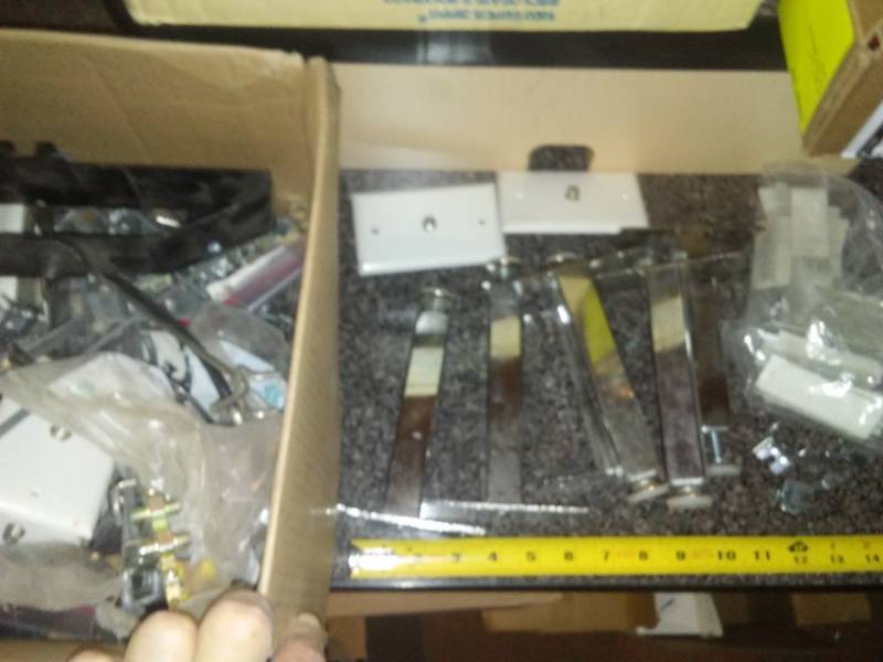 lot 4 image: Chrome adjustable legs, pegboard clips and hooks