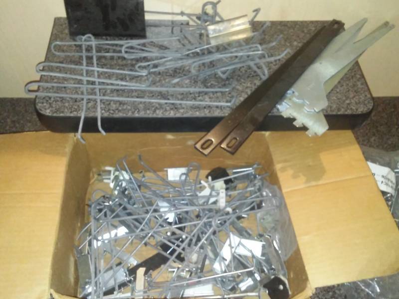 lot 25 image: Variety of slat wall and pegboard hanger hooks.