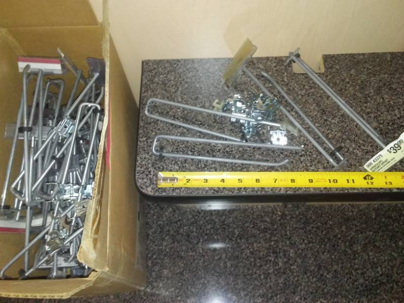 lot 31 image: Pegboard hooks with bases - Approx. 3 dozen.