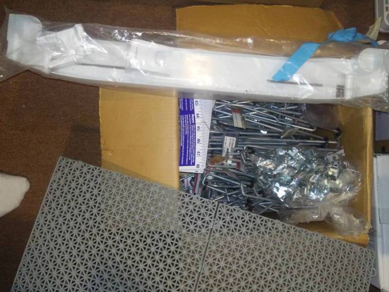 lot 62 image: Hooks, bases, tape measure, snap together floor, Appliance base and more.