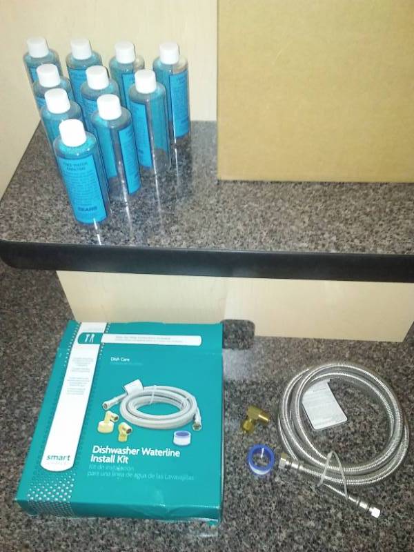 lot 39 image: Dishwasher braided hook up  32 water bottles.