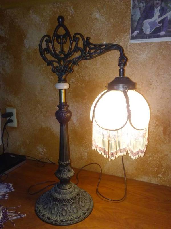 lot 97 image: Cast Lamp with beaded frosted glass shade.