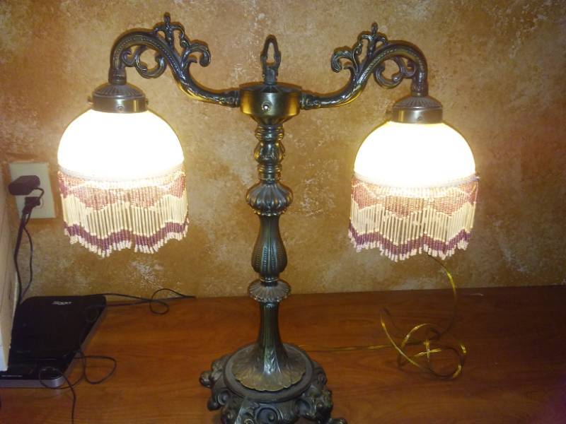 lot 98 image: Cast Lamp with Twin beaded frosted glass shade.