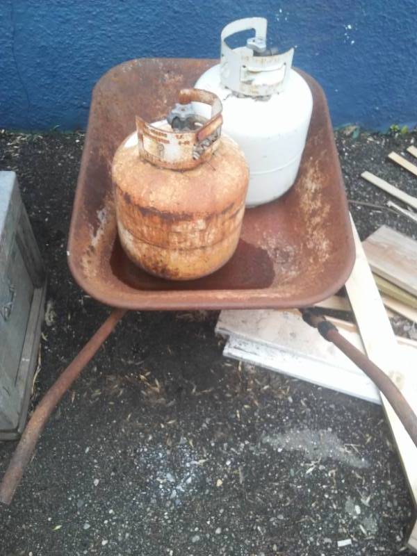 lot 107 image: Wheelbarrow and (2) 10 gal. LP Tanks
