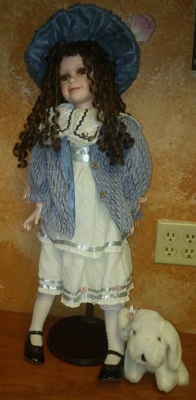 lot 118 image: Doll Classic Style, 30 in. wdog, on stand