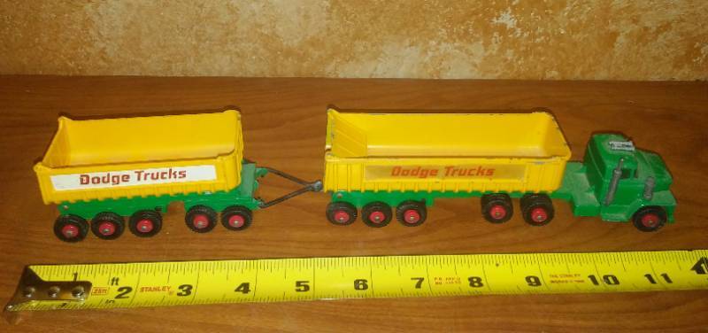 lot 121 image: Semi-Tractor and tandem trailer Metal Dodge Truck.