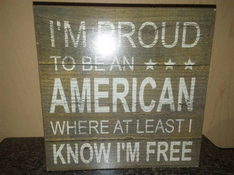 lot 156 image: Proud to be an American Sign.  New  Lee Greenwood Collection.