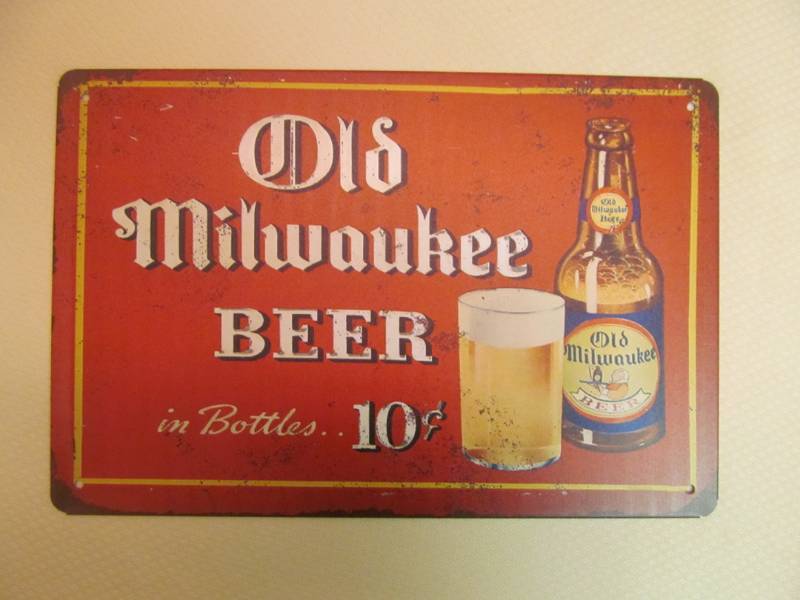 lot 122 image: tin sign