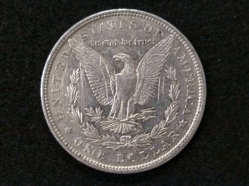 lot 6 image: 1879 Rev 79 Morgan Silver Dollar...