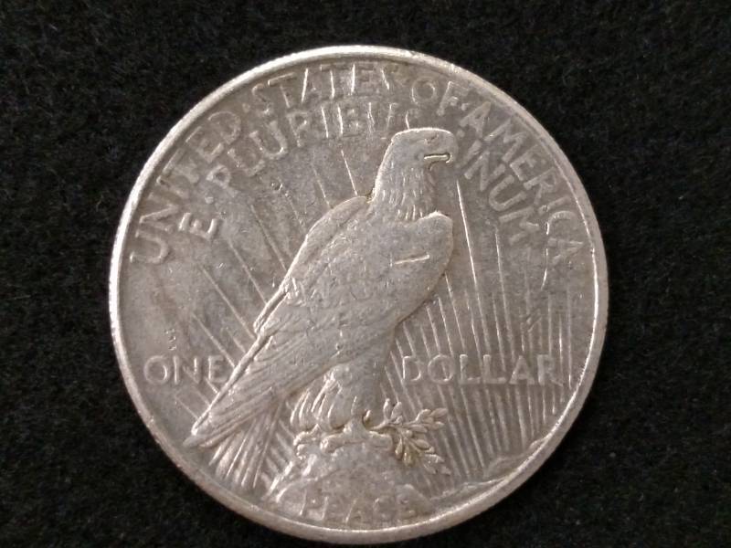 lot 67 image: 1925 Peace Silver Dollar...