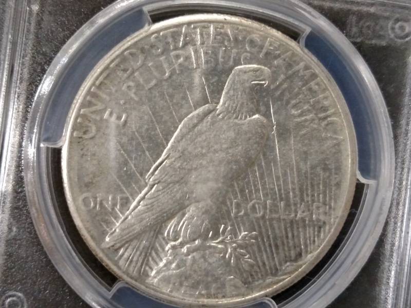 lot 72 image: 1928 PCGS AU58 Peace Silver Dollar,...