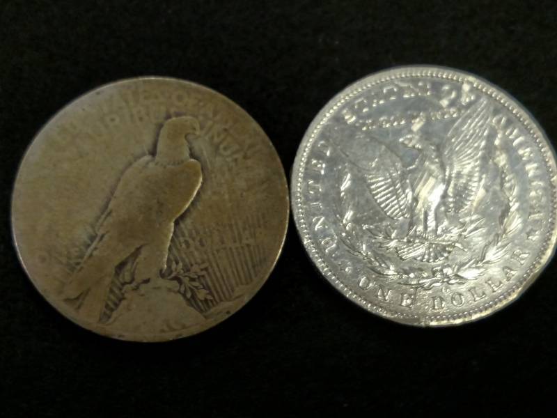 lot 76 image: (2) Silver Dollars...