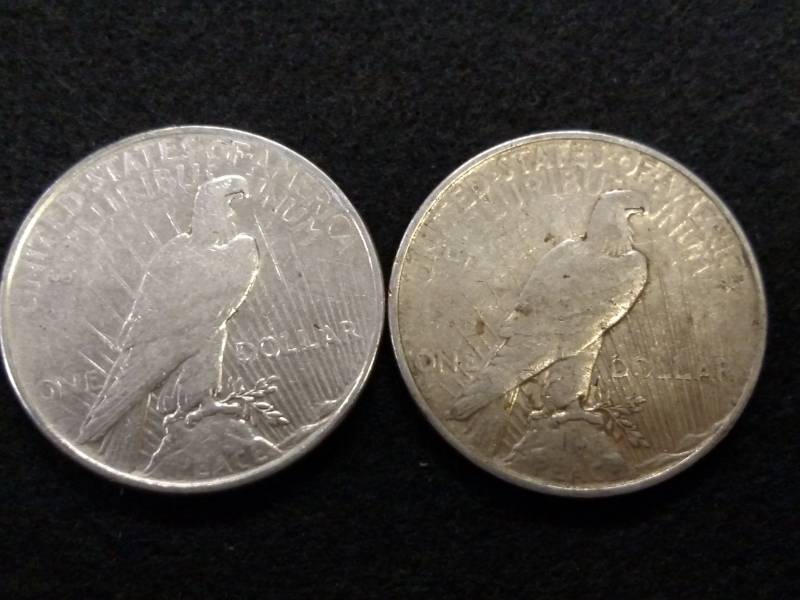 lot 77 image: (2) Silver Dollars...