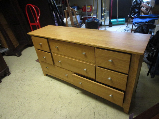 lot 603 image: EIGHT DRAWER WOOD DRESSER