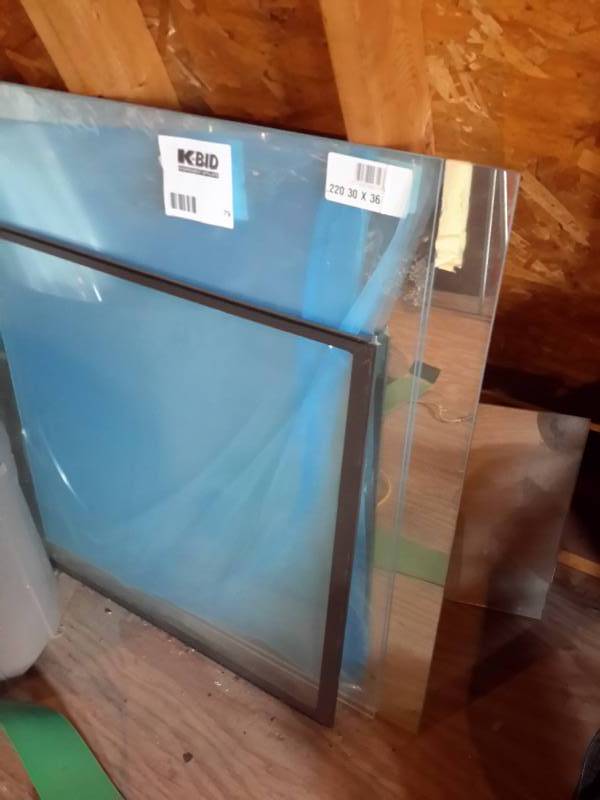 lot 79 image: 2 sheets of Plexiglass and a storm door glass section