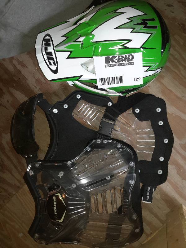 lot 129 image: Kane Helmet and Polaris Pads for moto cross racing