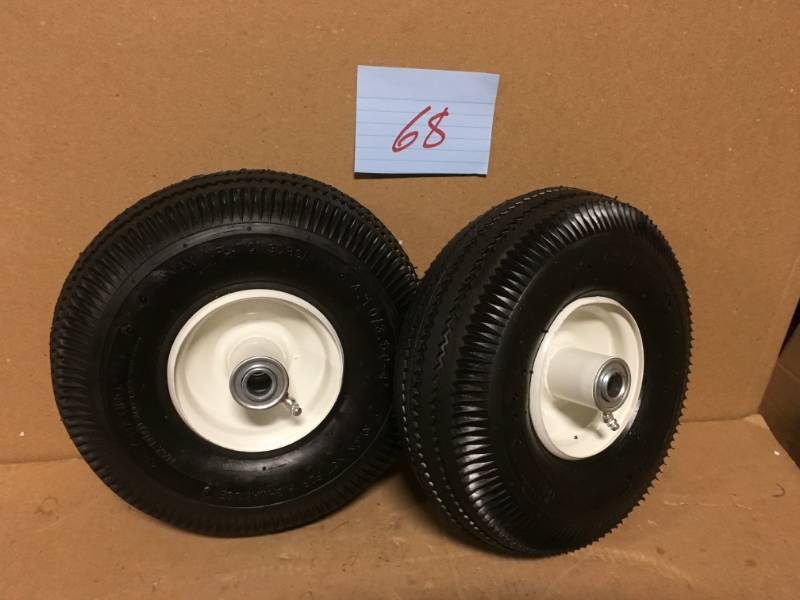 lot 68 image: Martin Wheel 4.103.50-4 10 in. Sawtooth Hand Truck Wheel with 2-14 in. x 58 in. Offset Hub QTY 2 in good condition