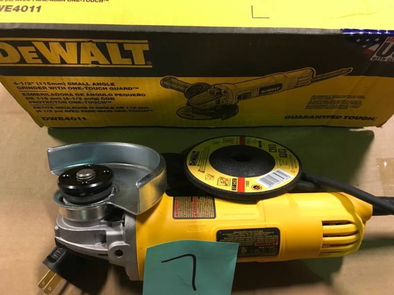 lot 7 image: DEWALT 7 Amp 4-12 in. Small Angle Grinder with 1-Touch Guard in like new condition