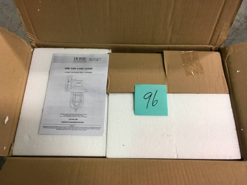 lot 96 image: Home Decorators Collection Wisteria Collection 1-Light Sand Black Large Outdoor Wall Mount Sconce with Clear Glass Shade in good condition