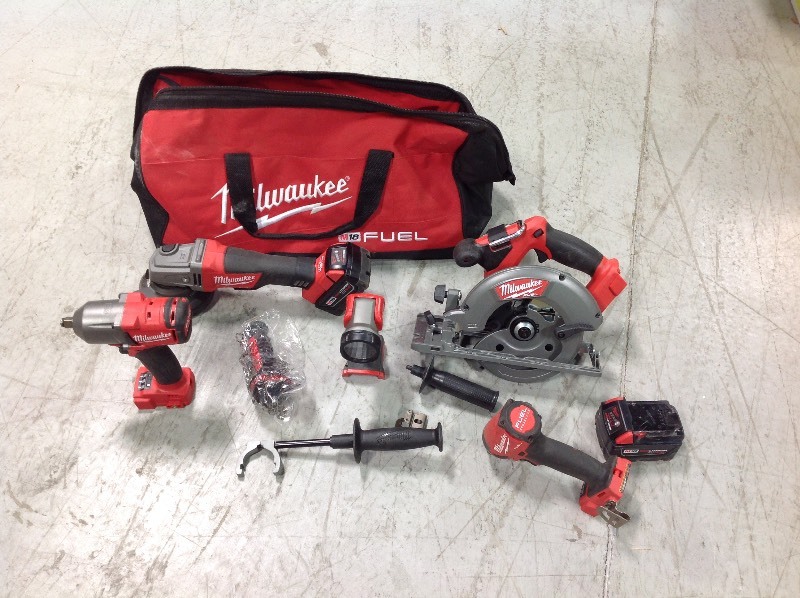 M18 FUEL 18-Volt Lithium-Ion Brushless Cordless Combo Kit (5-Tool) W (2) 4.0 Ah Batteries, (1) Charger, (1) Tool Bag in good conditions