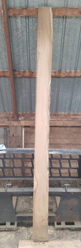 lot 7 image: 8 foot long rough cut lumber with 1 live edge