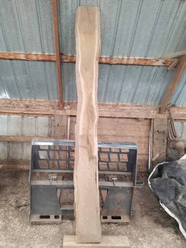 lot 15 image: 8 foot long rough cut oak lumber on both sides with natural or live edge