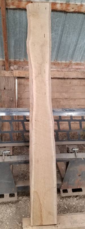 lot 16 image: 74 inch long oak rough cut lumber with 2 natural sides 1 inch thick