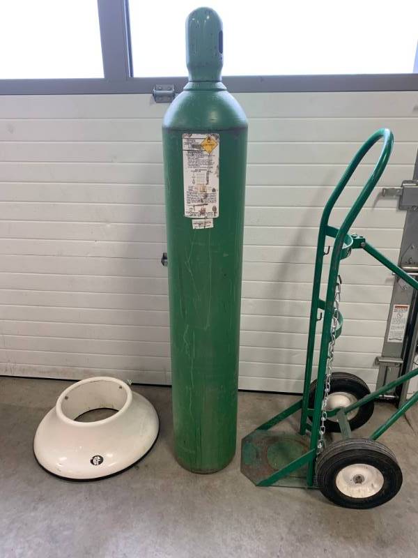 lot 15 image: Oxygen Tank Type T 55 Tall 9 Diameter (includes base holder and cart)