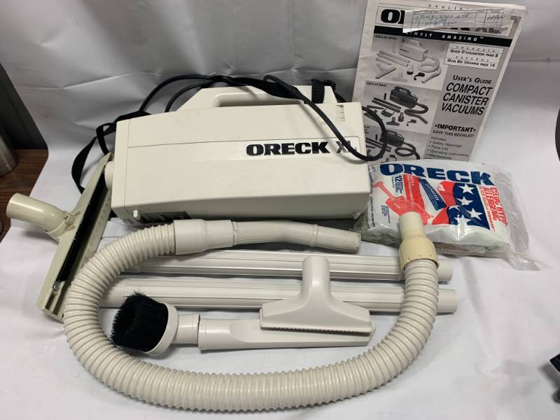 lot 55 image: Oreck XL Vacuum Cleaner with Attatchments