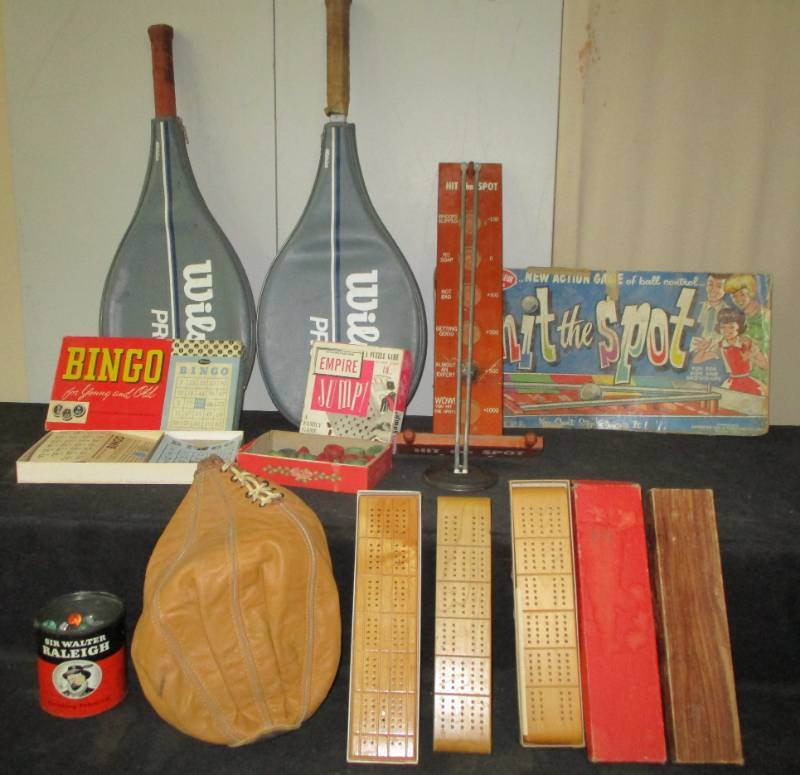 lot 33 image: Tennis Rackets, Cribbage Boards, Bingo game, Carom Board pieces, Hiot the Spot game