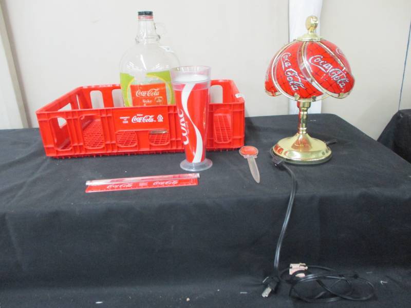 lot 115 image: Coca Cola Crate, Lamp, Bottle Cup and Ruler