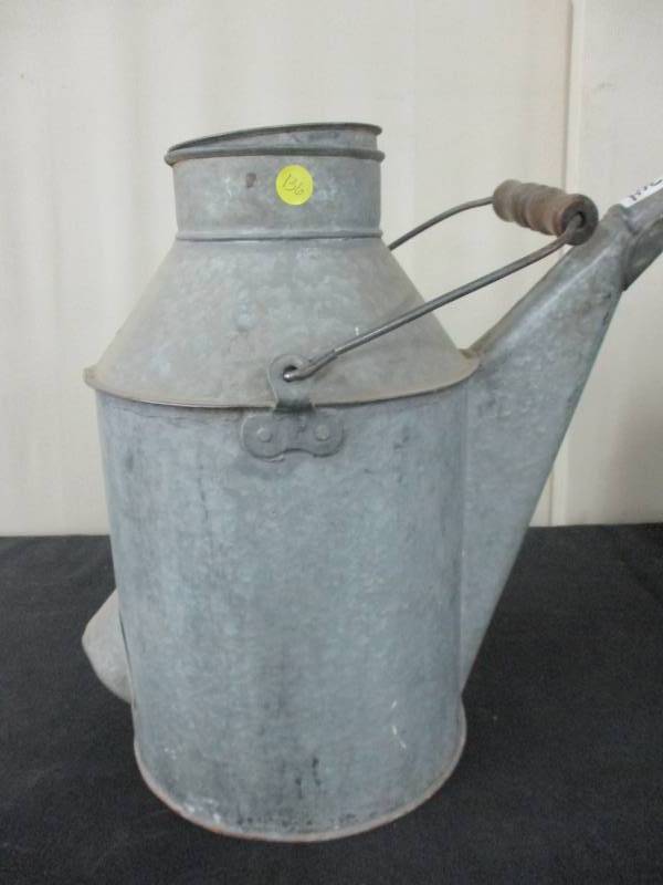 lot 136 image: Antique Galvanized Watering Can with Wood Handle Nice Condition