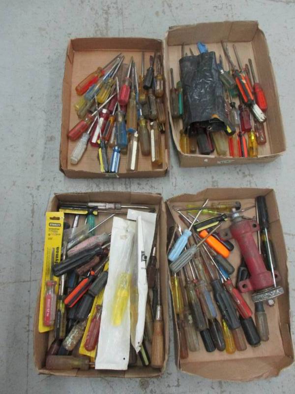 lot 143 image: 4 flats full of screwdrivers