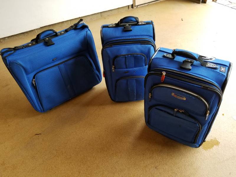 lot 80 image: Tumi and Delsey Luggage Set