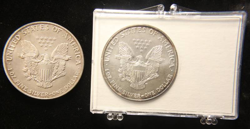 GROUP OF 2 US .999 FINE SILVER EAGLES 1990 & 2002