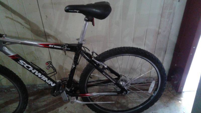 lot 8 image: Schwinn SX 2000, Rim May Be Bent, May Need Some Maintenance, Has An Extra Pair Of Rims With It