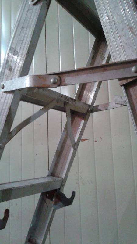 lot 20 image: Very Tall Aluminum Folding Ladder, Hinge Has A Bend In It