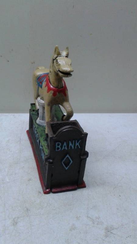 lot 73 image: Trick Pony Cast Iron Bank