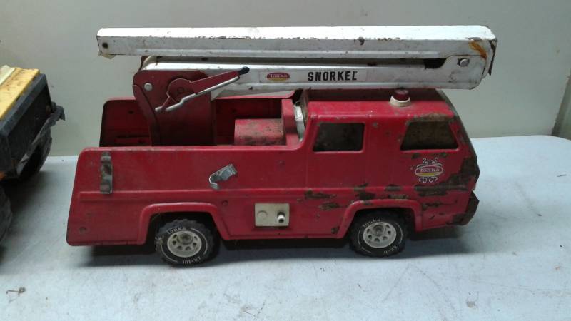 lot 81 image: Vintage Tonka Fire Truck And Nylint Dump Truck, Both Show Lots Of Wear