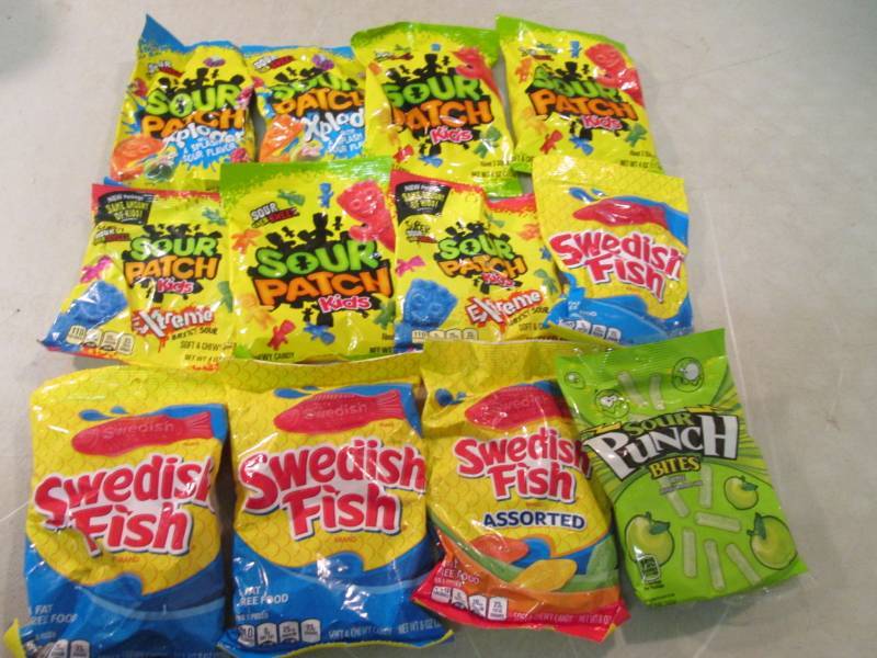 lot 99 image: 12 Assorted Bags of Candy Best by d...
