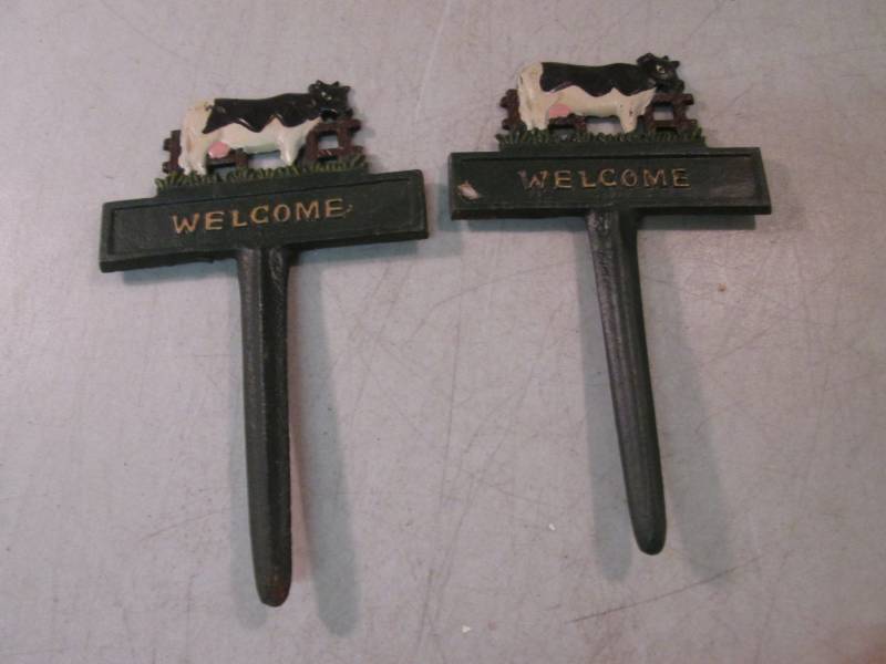 lot 138 image: 2 Cast Iron Welcome with Cows Stake...