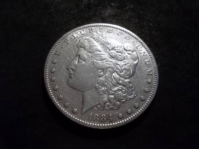 lot 11 image: 1884 S Morgan Silver Dollar