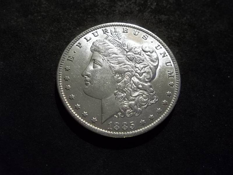 lot 13 image: 1885 O Morgan Silver Dollar