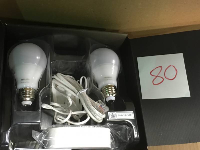 lot 80 image: Philips Hue White A19 60W Equivalent LED Smart Bulb Starter Kit (2 A19 White Bulbs and 1 Hub Compatible with Amazon Alexa Apple HomeKit and Google Assistant) in good condition